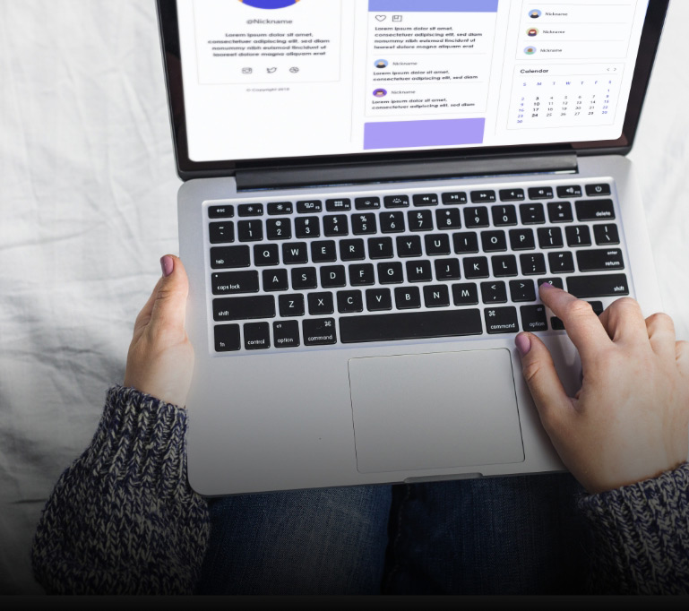 person-using-laptop-bed-1
